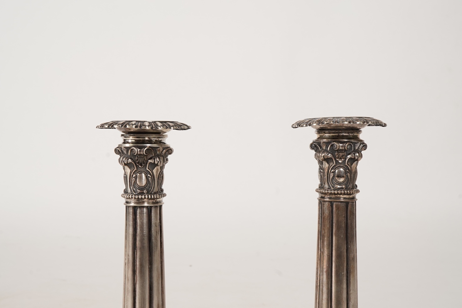 A pair of late 18th/early 19th century German white metal candlesticks, maker's mark W.C.H & S